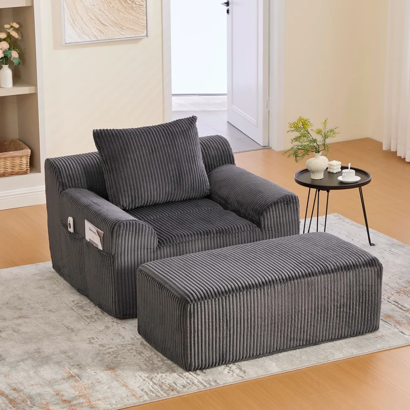 Canapé simple fauteuil XXL en velours côtelé gris, dossier profond, repose pied, coussin & poches latérales, sans montage HOTSPRINGPOOL