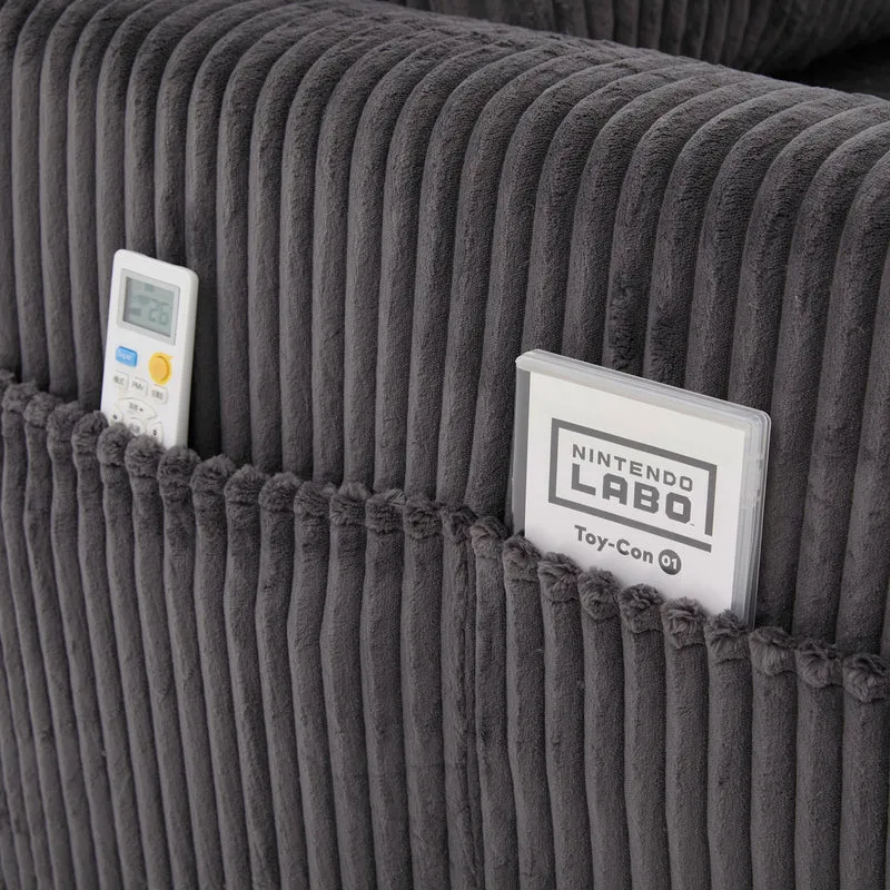 Canapé simple fauteuil XXL en velours côtelé gris, dossier profond, repose pied, coussin & poches latérales, sans montage HOTSPRINGPOOL