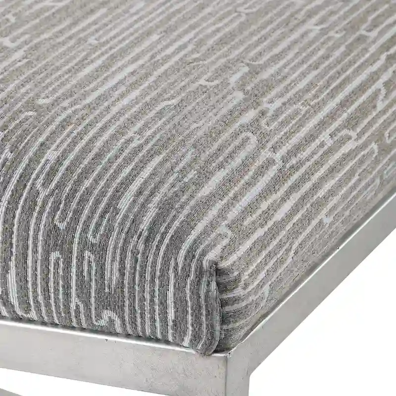 Banc géométrique avec piètement en fer forgé et finition feuille d'argent brossé