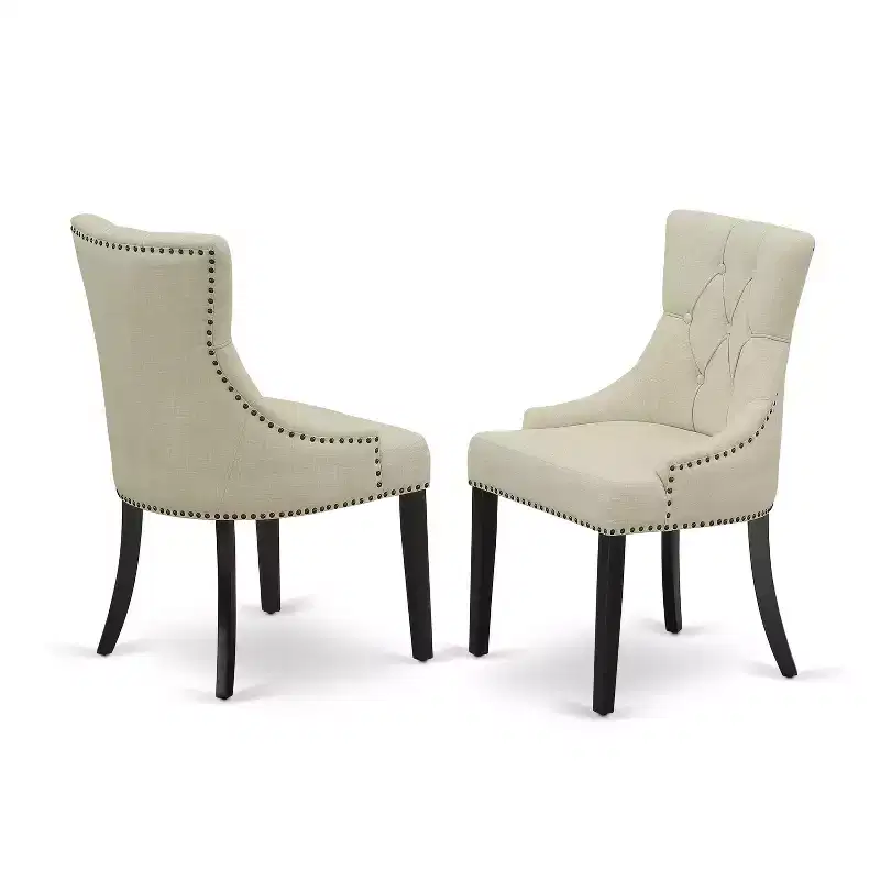 Ensemble de salle à manger HomeStock 5 pièces comprenant une table de salle à manger ronde avec rallonges et quatre chaises Parson avec tissu beige clair, finition noire.